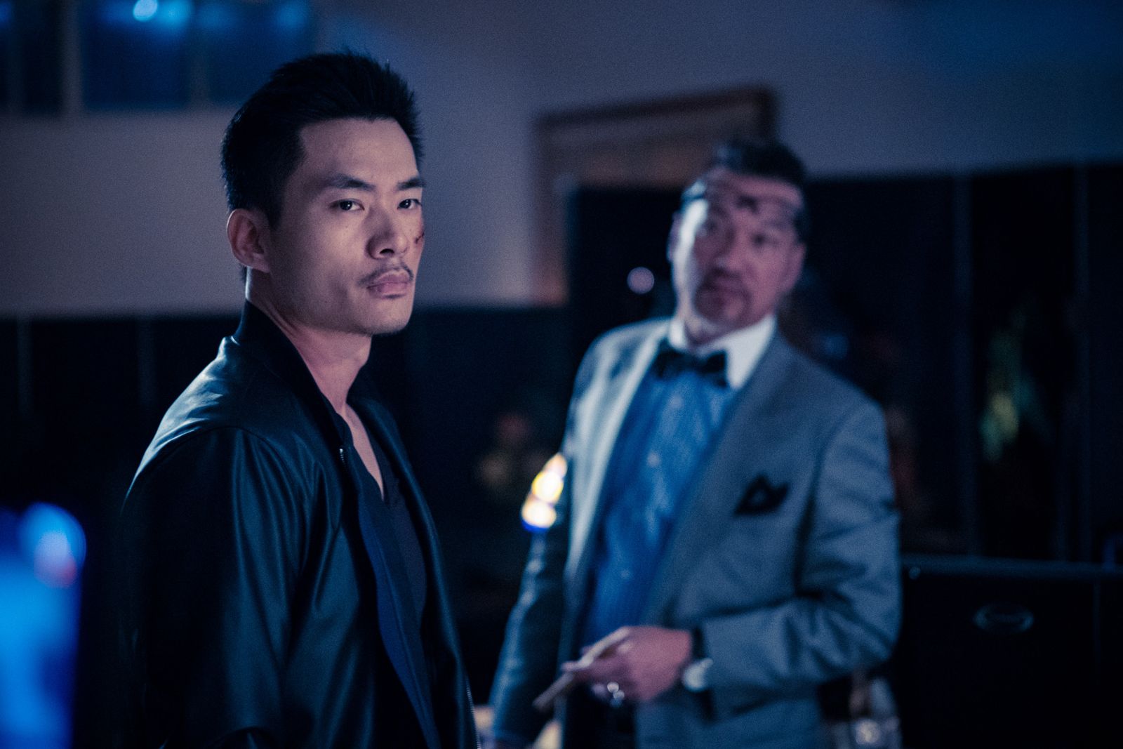 Kuang Feng and a man in a grey suit